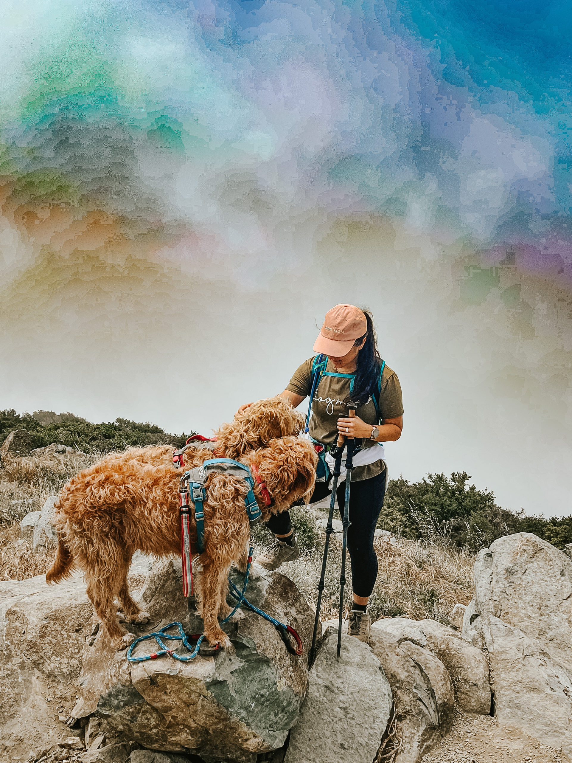 Julianna stands on top of Santiago Peak with Chase and rado.